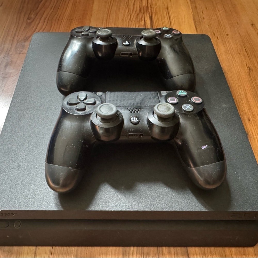 Sony Black PS4 Slim with Two Black DualShock 4 Controllers and 7 Games